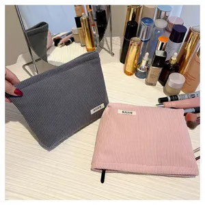 Corduroy cosmetic bag for women, solid color makeup pouch, portable storage clutch and purse.