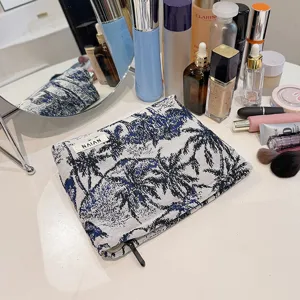 Trousse de maquillage portable en toile avec imprimé palmier, grande capacité pour voyage.