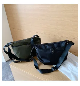 Casual nylon crossbody bag for women, simple shoulder bag with wide strap and zip pocket.