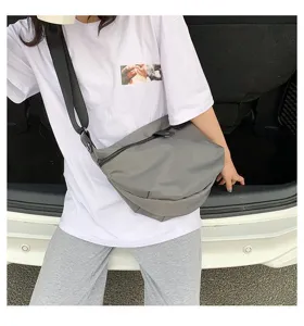 Casual grey nylon crossbody bag for women, simple messenger shoulder bag for daily wear.