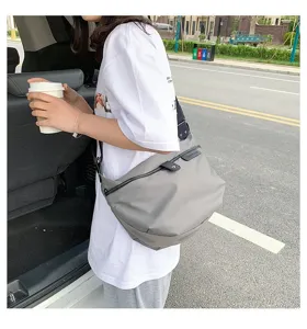 Detailed view of the women casual nylon crossbody bag, simple shoulder bag design in grey.