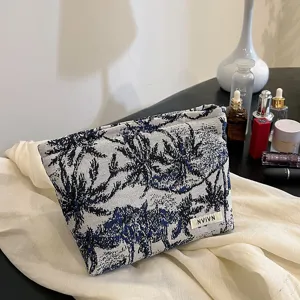 Trousse de maquillage portable à imprimé botanique bleu et blanc, grande capacité de voyage.