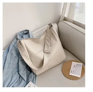Casual PU leather shoulder bag for women, solid color hobo crossbody bag with stitching details.