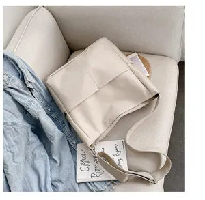 Classic PU leather shoulder bag for women, casual solid color tote bag with wide strap.
