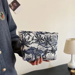 Grande trousse de maquillage pour voyage et organisation quotidienne, design imprimé élégant.