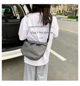 Casual grey nylon crossbody bag for women, stylish shoulder bag with simple daily design.