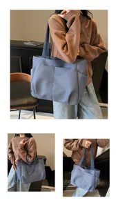 Minimalist blue canvas tote bag with multiple pockets, casual single-shoulder design.