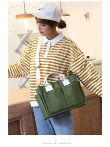 Casual canvas tote bag for women, large capacity shoulder bag with multiple pockets detail.