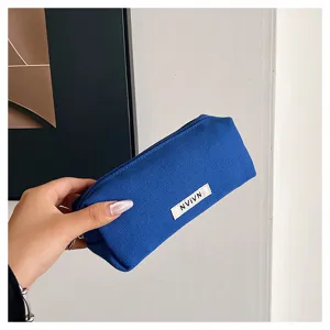 Blue canvas pencil case, simple large capacity student stationery storage bag and cosmetic pouch.