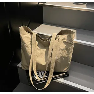 Large capacity solid color casual tote bag with multi pockets for daily commute work use.
