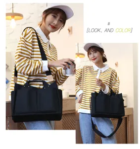 Large capacity canvas tote bag, casual shoulder handbag with multiple pockets and straps.