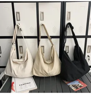 Lässige Canvas Schultertasche für Damen, große Alltagstasche und modische Umhängetasche.