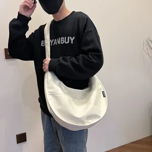 Stylish women solid color dumpling shoulder bag casual large capacity crossbody tote bag.
