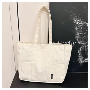 Large capacity canvas tote bag for women, minimalist shoulder bag for daily commuting and school use.