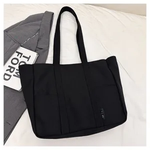 Black canvas tote bag for women, large capacity shoulder bag, casual Japanese style commuter bag.