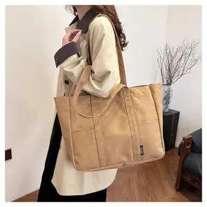Large capacity canvas tote bag for women, Japanese style commuter shoulder bag with multi pockets.
