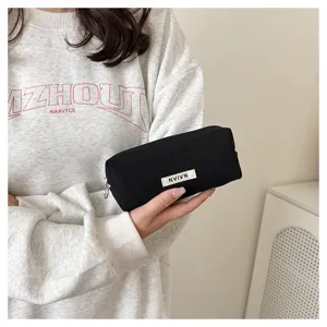 Minimalist black canvas pencil pouch, large capacity stationery storage bag for students.