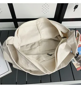 Weisse Canvas Tote Bag Innendetail, grosse Kapazitaet laessige Umhaengetasche fuer Damen Alltag.
