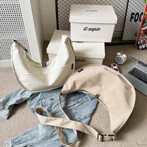 Korean style solid color large canvas dumpling shoulder bag for women casual use.