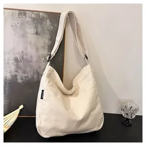 Casual white canvas shoulder bag for women, large capacity tote bag with adjustable strap.