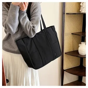Casual black canvas tote bag for women, large capacity shoulder bag for daily commute and school.