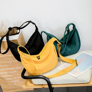 Stylish nylon crossbody dumpling bag for women, casual simple shoulder bag for everyday use.