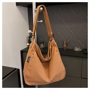 Casual canvas shoulder bag for women, large capacity versatile tote bag, stylish crossbody bag.