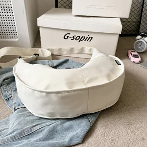 Solid color white dumpling shoulder bag, casual crossbody bag for women with wide strap.