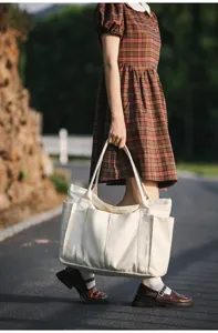 Simple minimalist canvas tote bag for women, large capacity multi-pocket casual daily handbag.