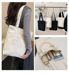 Solid color canvas shoulder bag, large capacity multi-pocket tote bag with zipper closure for daily use.