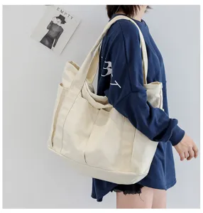 Casual canvas tote bag for women, large capacity shoulder bag with pockets for daily use.
