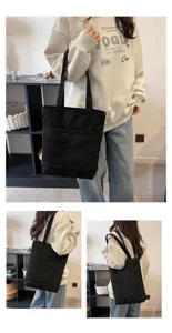 Black canvas tote bag for daily use, casual shoulder bag with front pocket design.