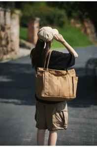 Detail view of the stylish large capacity canvas tote bag, showing shoulder wear effect.