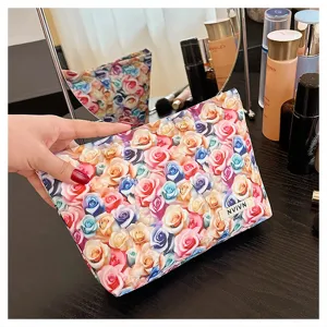 Detailed view of large capacity floral cosmetic bag with vibrant 3D rose print and handy label.
