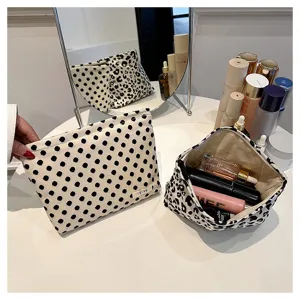 Canvas cosmetic bag large capacity portable makeup pouch with leopard and polka dot design.