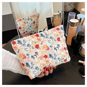 Floral cosmetic bag for women, large capacity makeup pouch with aesthetic 3d flower design.