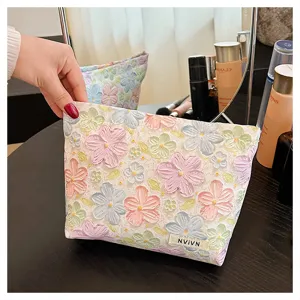 3D floral makeup bag detail view, stylish aesthetic pouch for daily cosmetics and toiletries storage.