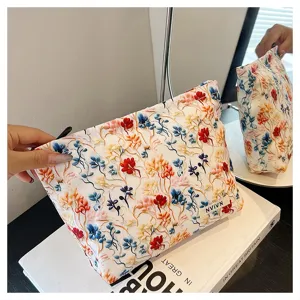 Chic 3D floral embroidered cosmetic bag, portable makeup pouch and large capacity daily organizer.