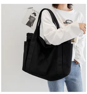 Black canvas tote bag for women, large capacity casual shoulder bag, daily student travel.
