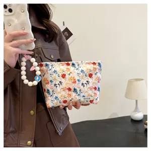 Floral embroidered cosmetic bag for women, large capacity travel pouch for toiletries and makeup.