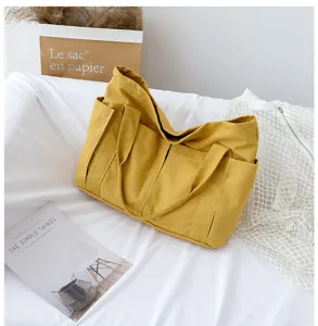 Yellow canvas tote bag with multi pockets, casual large capacity shoulder bag for women.