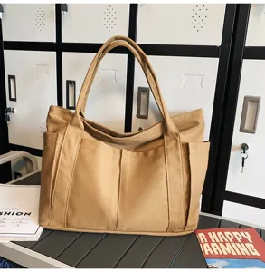 Simple canvas tote bag for women, large capacity casual shoulder bag with side pockets.