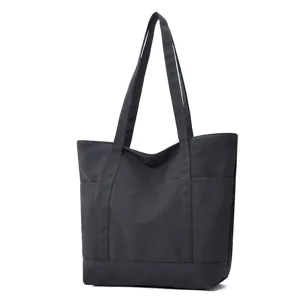 Sac cabas en toile noire avec plusieurs poches, grand sac a epaule pour le quotidien.