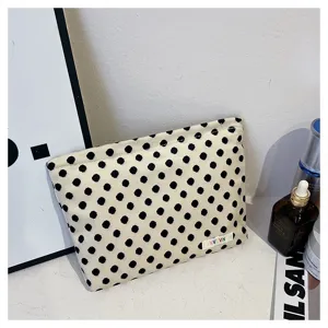 Black and white polka dot cosmetic bag, portable makeup pouch and large capacity clutch.
