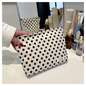 Black and white polka dot canvas makeup bag, portable zipper cosmetic storage pouch for women.