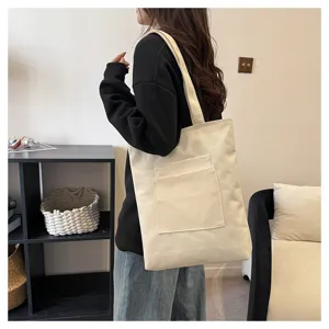 Canvas tote bag for women, large capacity shoulder bag with an outer pocket design.