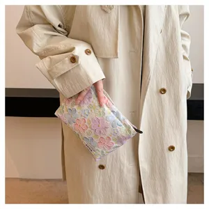 3D floral cosmetic pouch detail shot, aesthetic makeup storage bag for women and travel toiletries.