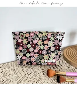 Portable floral cosmetic bag makeup storage pouch with cute daisy pattern for daily travel use.