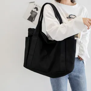 Black canvas tote bag for women, large capacity casual shoulder bag with side pockets, everyday.