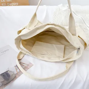 Canvas tote bag for women, large capacity casual shoulder bag with zipper and inner pocket.